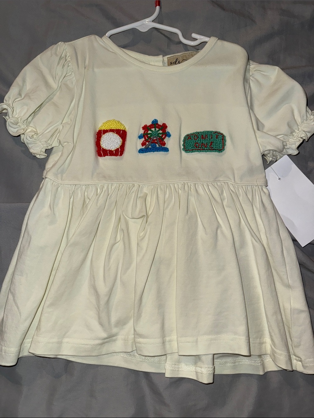 Cream Toddler Peplum Top with Colorful Embroidered Patches